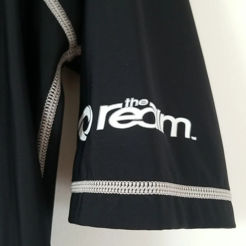 The Realm mens rashguard black/white swim surf shirt.